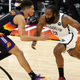 Phoenix’s Devin Booker guards Brooklyn’s James Harden in the Nets’ 128-124 come-from-behind victory Tuesday Night.